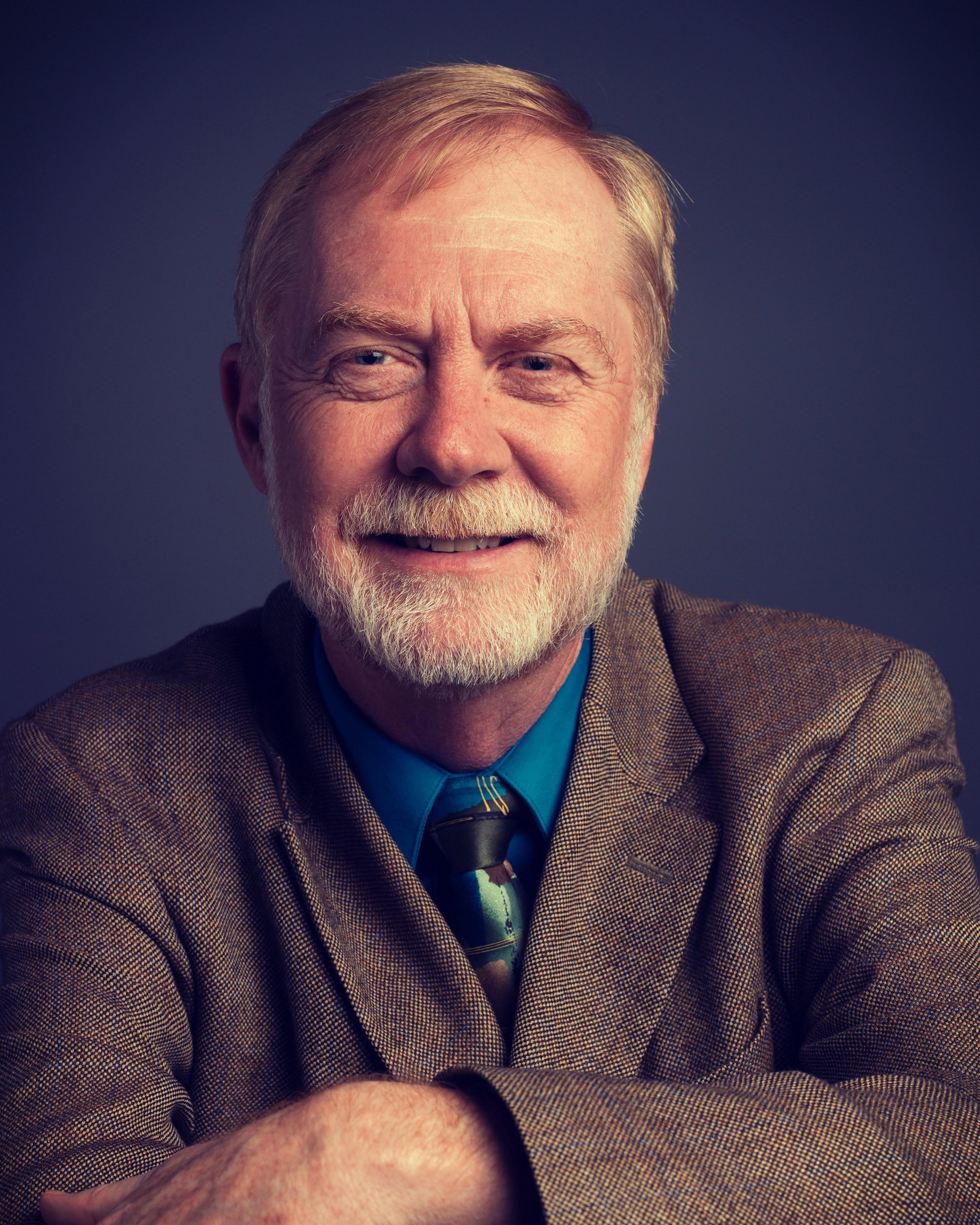 Jerry Mitchell, an elderly white man Posing for a photograph.