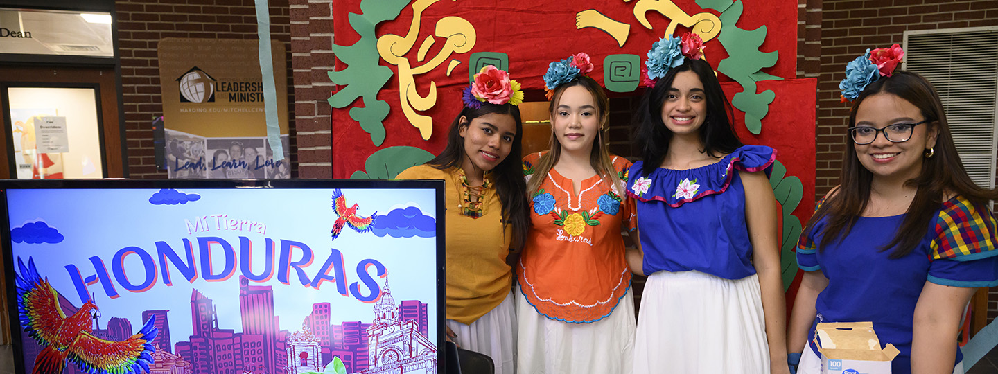 Four students in their counties clothing