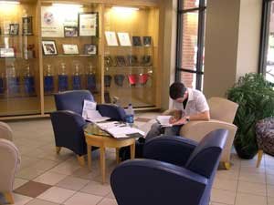 lobby lounge with a student workiing