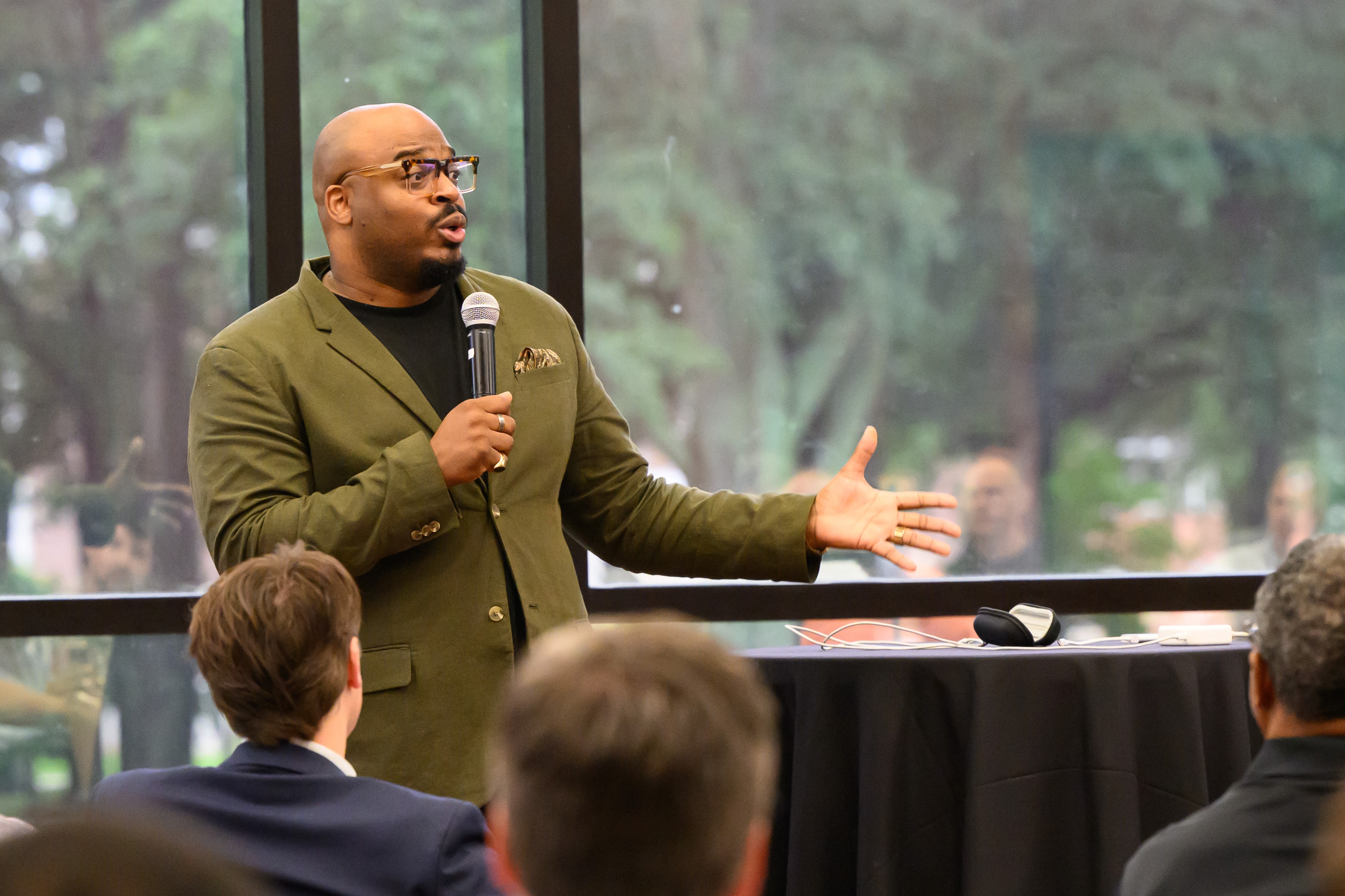 B. Chris Simpson speaking in Cone Chapel