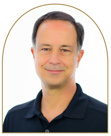 Buddy Bell in a black shirt, smiling.