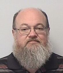 Headshot of John Exum