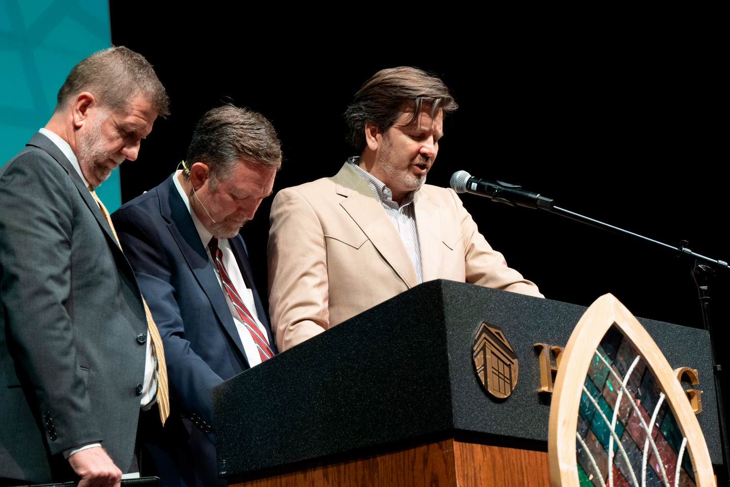 Dr. Sandlin and Dr Adair pray for Dr. Monte Cox