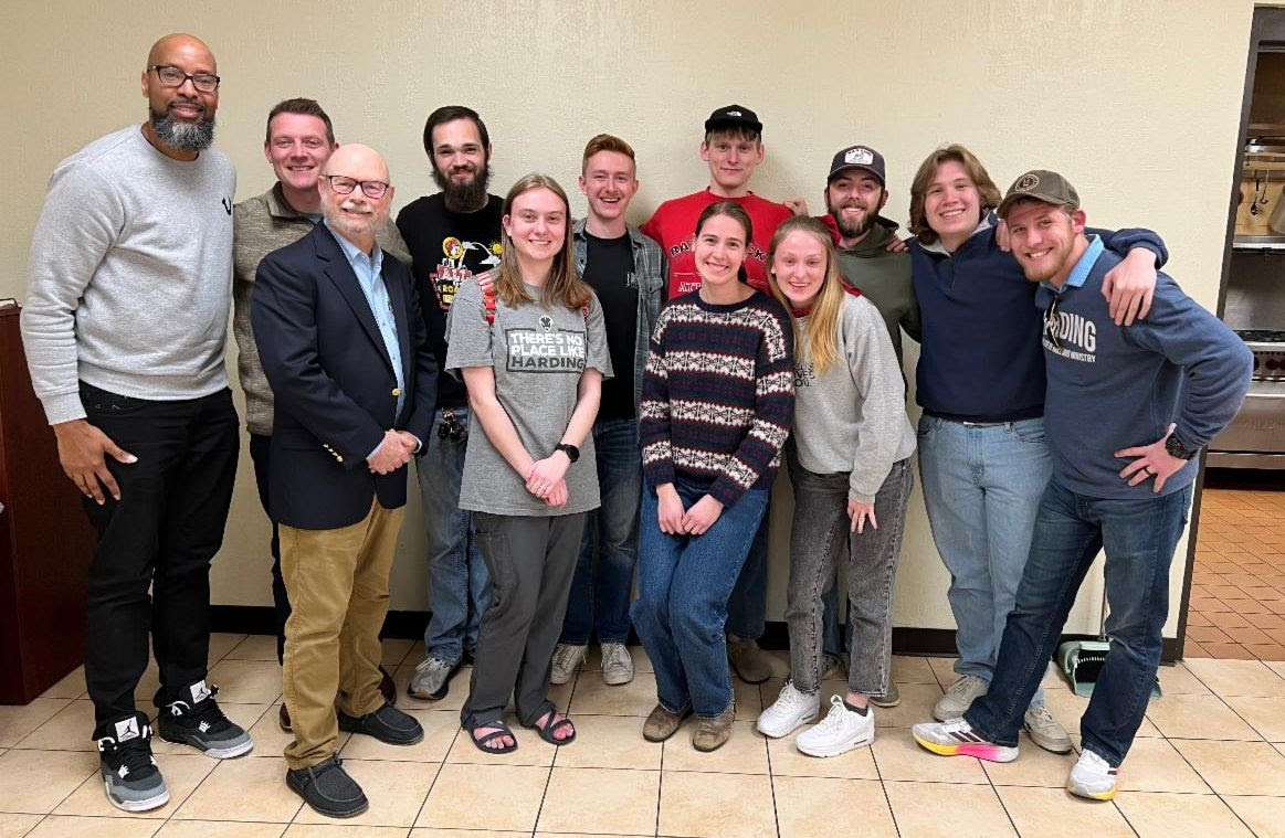 Group of Harding church planting students, professors, and others smiling together for a group photo.