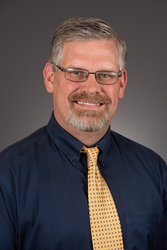 Headshot of Alan Hewett